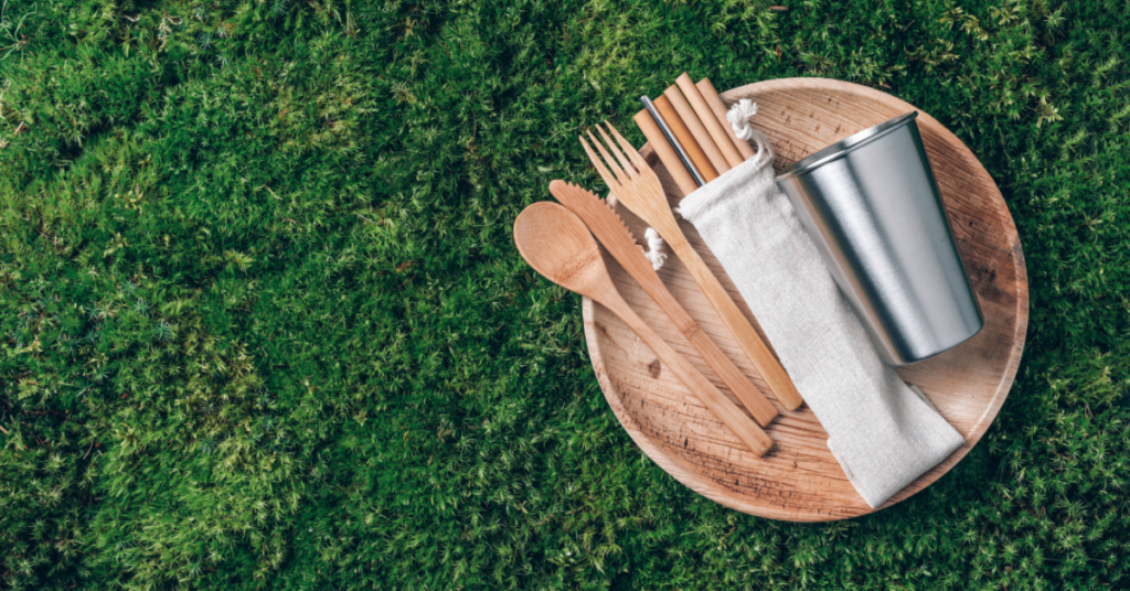 Reusable wooden cutlery on grass