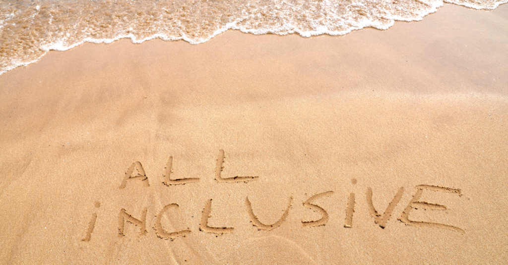 'All inclusive' written in the sand