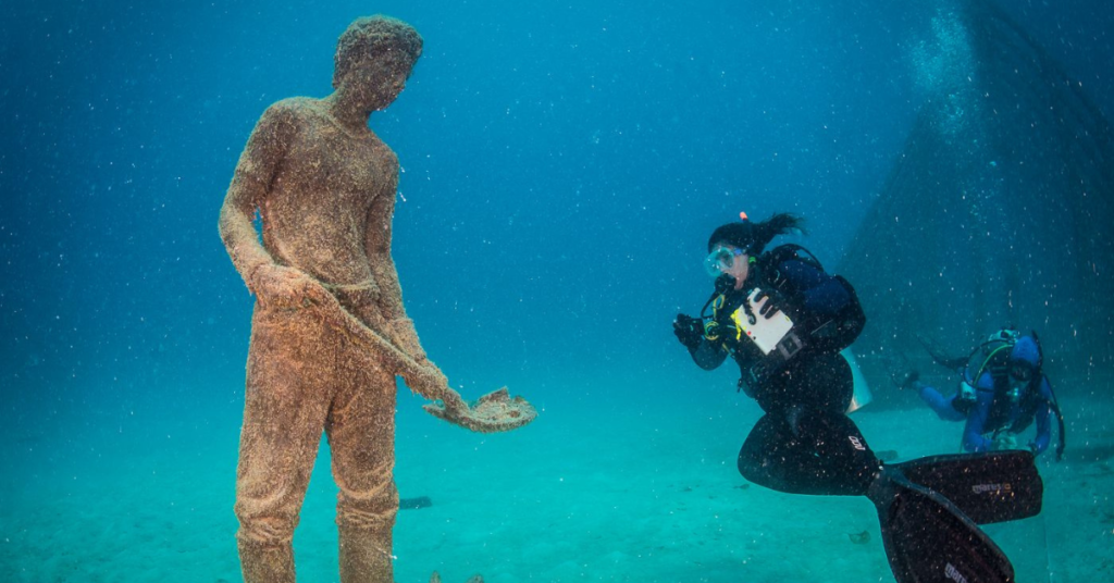 Under water art sculpture and divers