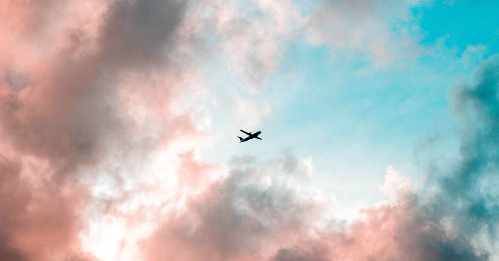 Plane in a pink and blue sky
