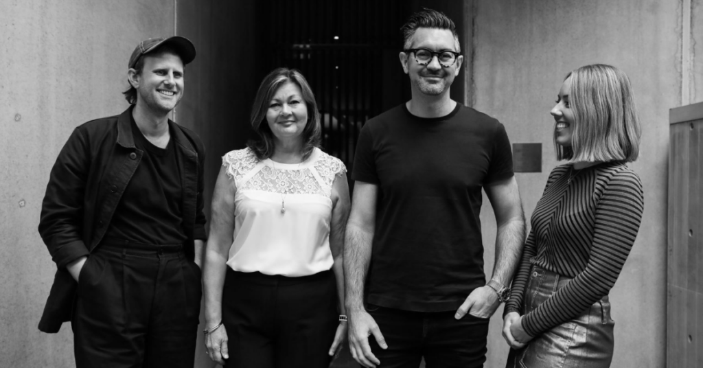 The Pure Finance team, black and white photo of four people