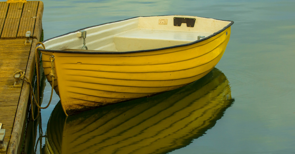 Yellow boat tied to a pier
