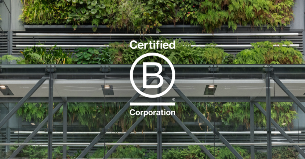 Photo of a building with plants and the Certified B Corporation logo overlayed.