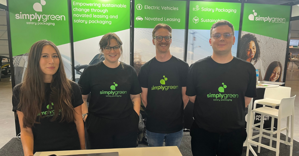 Simplygreen team at an event wearing branded t-shirts.