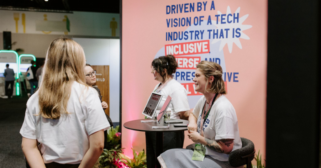 Code like a girl team interacting with attendees of SXSW Sydney event present at the b Corp booth.