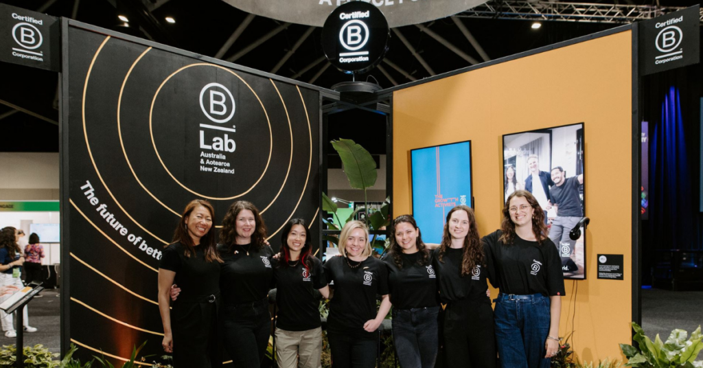 B lab team members: Mindy, Lauren, Azita, Angie, Mela, Paige and Lucinda in front of the B Lab B Corp Booth at SXSW Sydney