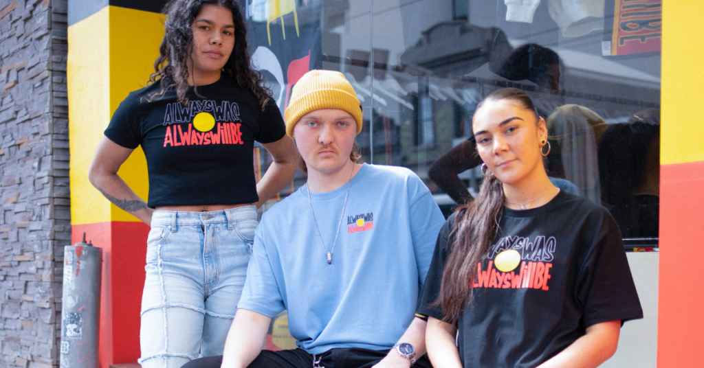 Three models wearing Clothing The Gaps merchandise with "Always Was, Always Will Be" slogan printed on T-shirts.