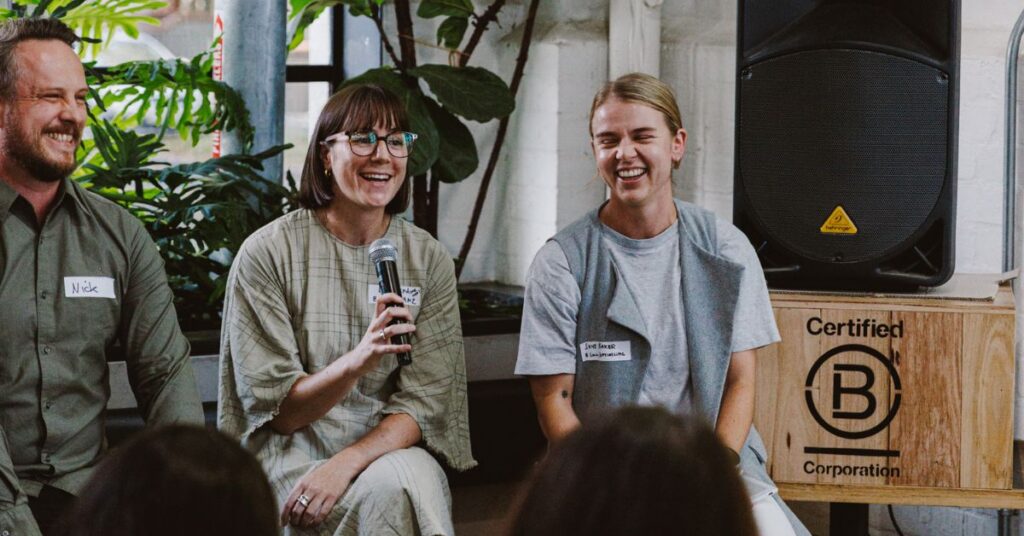 Three people talking on a panel