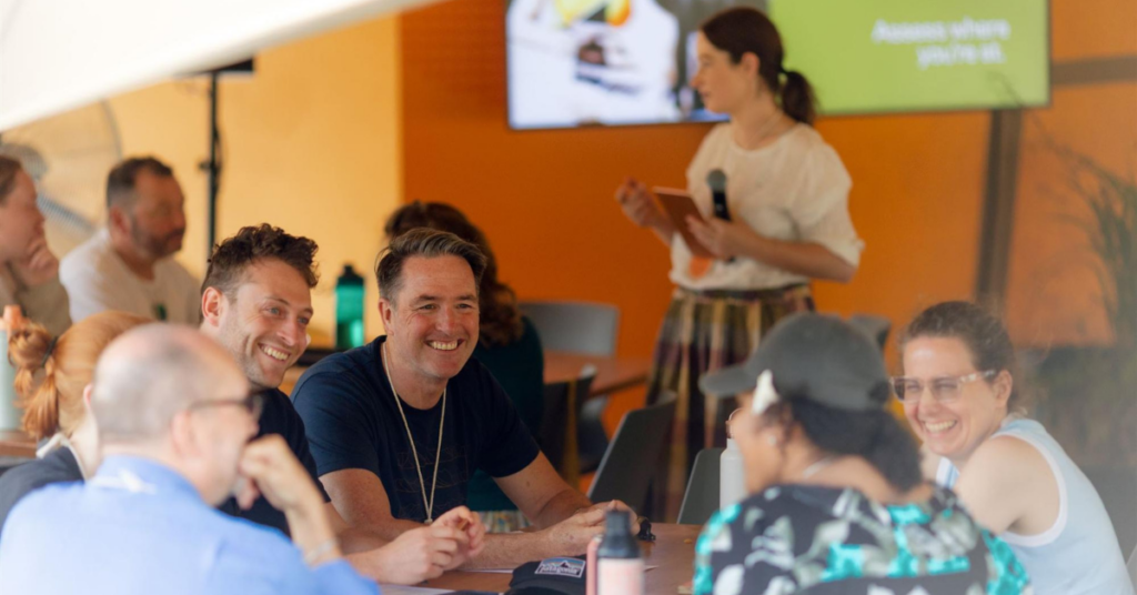 A group of people sat at a table discussing the new standards.