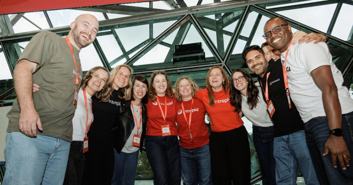 Group photo of Intrepid team members at an event.